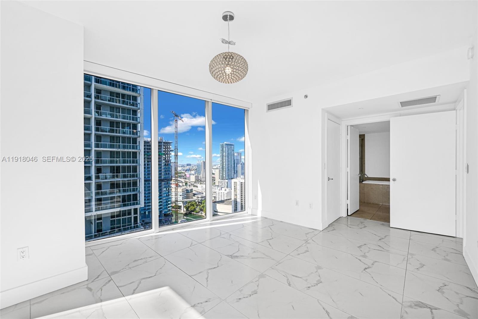 475 Brickell Avenue, Unit 3113 Miami, FL 33131 - Photo 10 of 28 a view of an empty room with a window