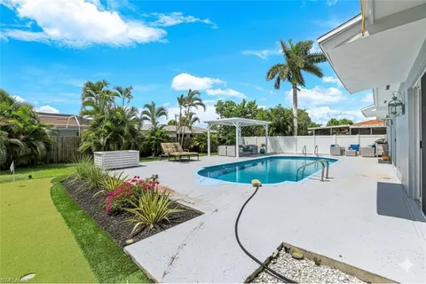 a view of a swimming pool with a patio