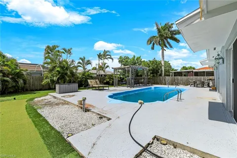 a view of a swimming pool with a patio