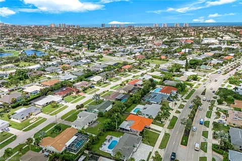an aerial view of residential houses with outdoor space