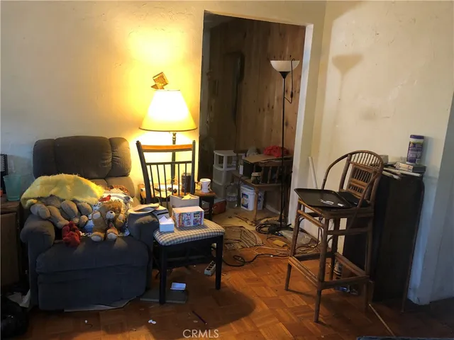 a view of a hallway to a livingroom and a hallway