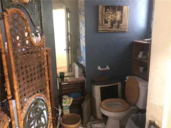 a view of workspace with wooden floor and windows