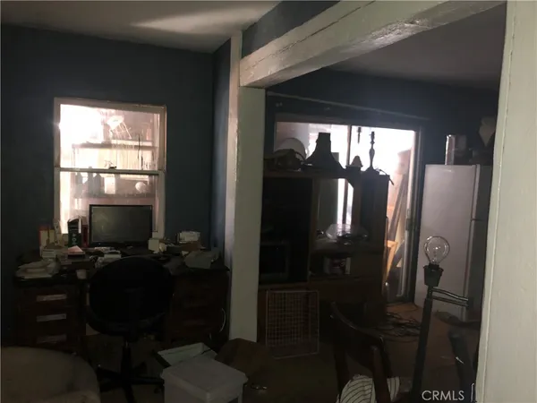 a balcony with a table and chairs