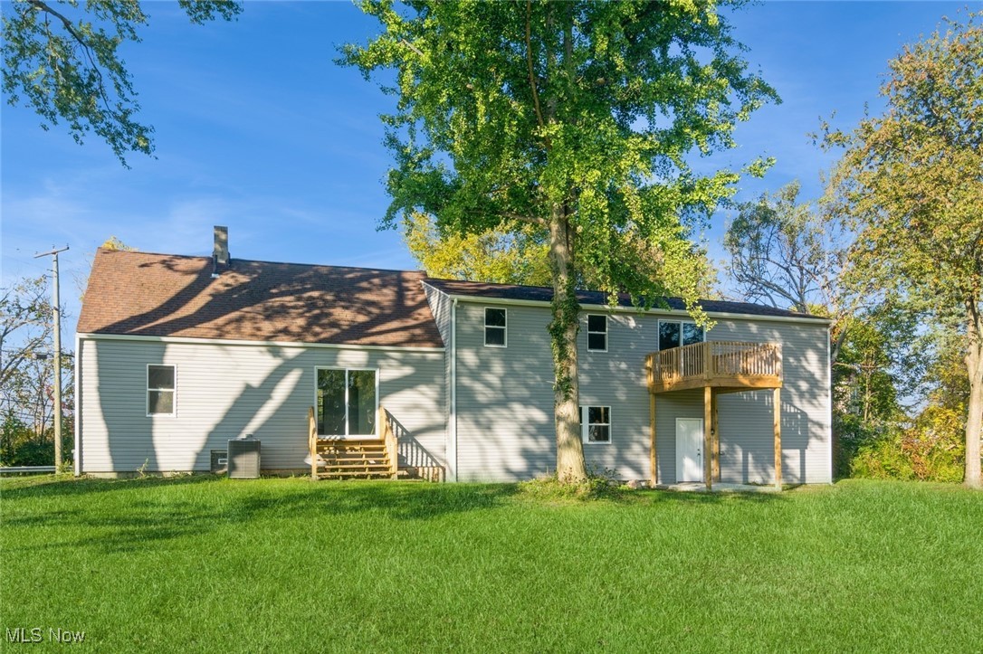 1432 Gulf Road Elyria, OH 44035 - Photo 16 of 17 Back of house with a deck and a lawn