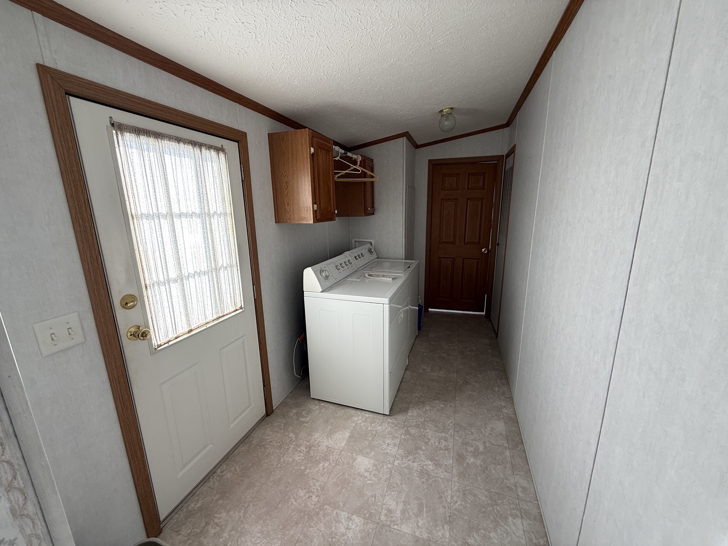 4 Cynthia Lane Beecher, IL 60401 - Photo 7 of 20 a view of storage and utility room with washer and dryer