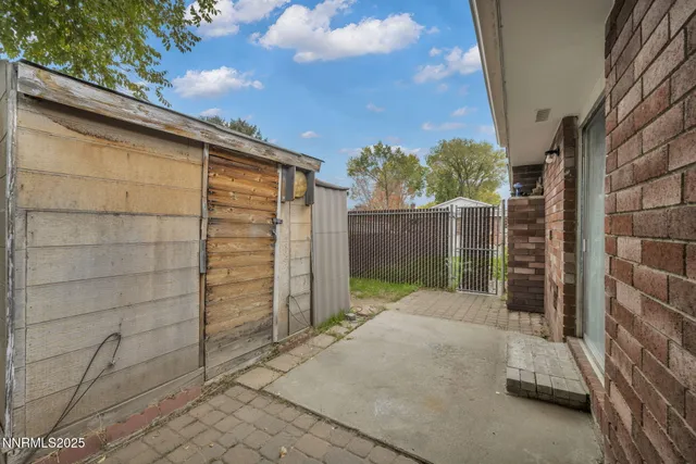 a view of a house with a tree