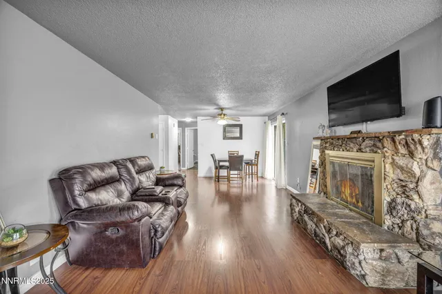 a view of a dining room with furniture wooden floor and chandelier