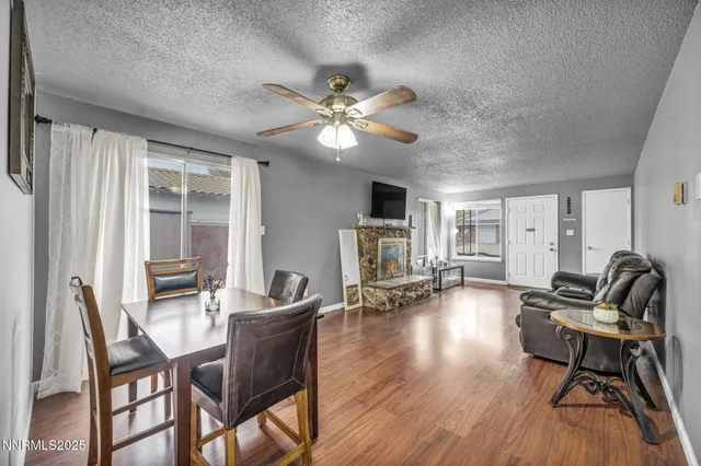a kitchen with cabinets stainless steel appliances and a window