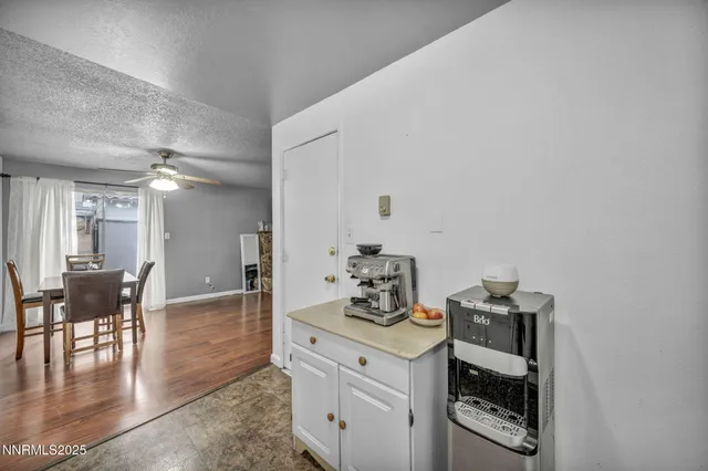 a white stove top oven sitting inside of a kitchen