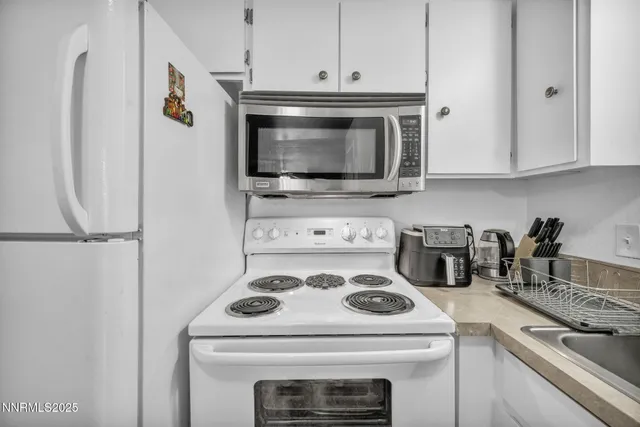 a bedroom that has a bed and a table in it