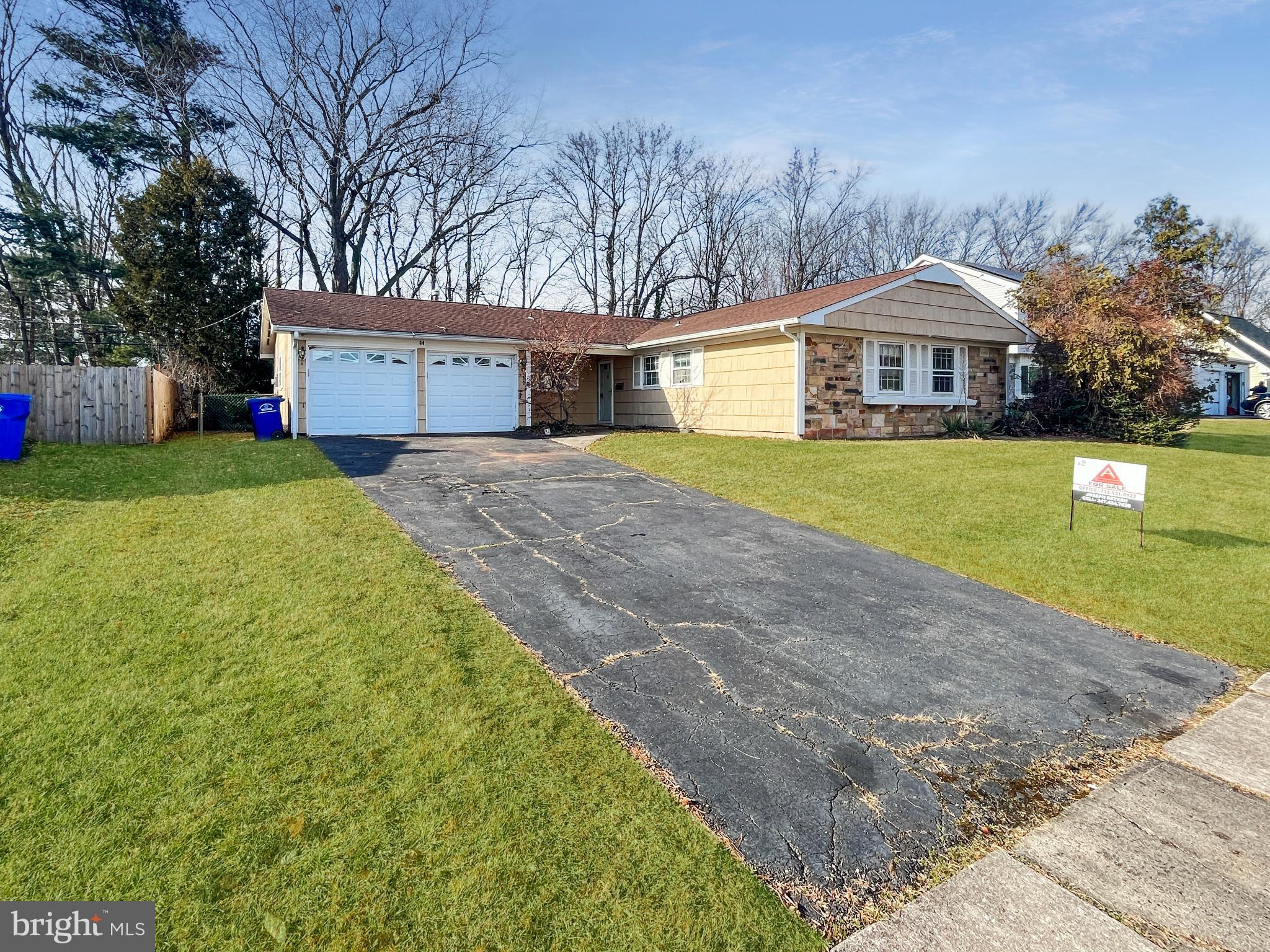 34 East River Drive Willingboro, NJ 08046 - Photo 2 of 15 a front view of a house with a yard and garage