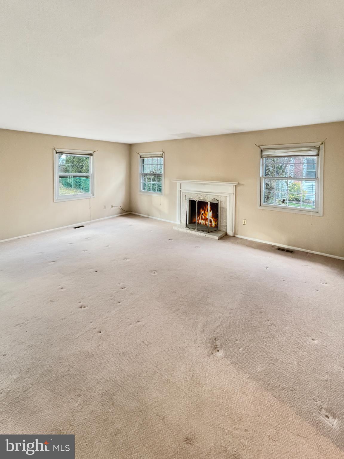 34 East River Drive Willingboro, NJ 08046 - Photo 4 of 15 an empty room with fireplace and chandelier