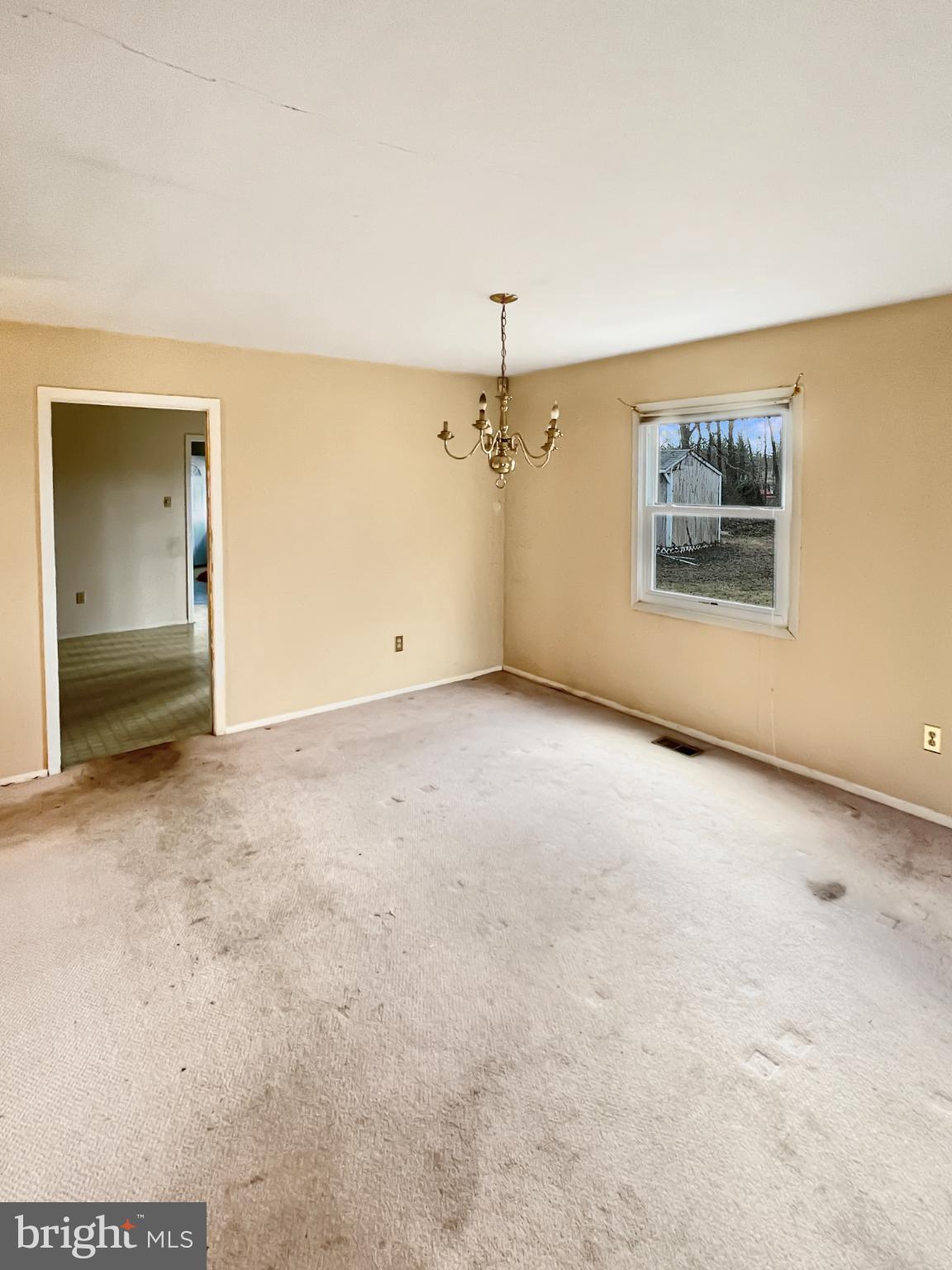 34 East River Drive Willingboro, NJ 08046 - Photo 6 of 15 an empty room with a ceiling fan and window