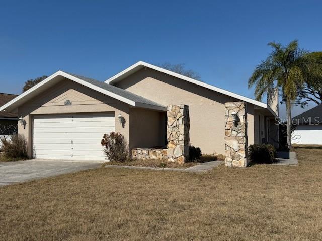 4513 Dewey Drive New Port Richey, FL 34652 - Photo 1 of 29 a view of a house with a yard