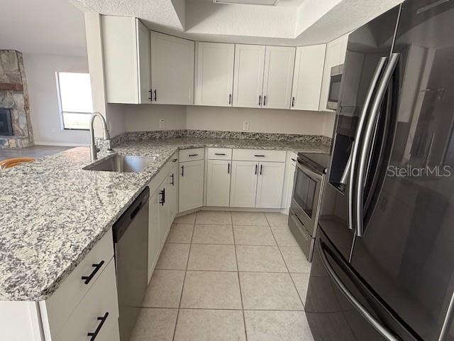 4513 Dewey Drive New Port Richey, FL 34652 - Photo 13 of 29 a kitchen with a refrigerator sink and cabinets