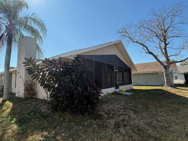 4513 Dewey Drive New Port Richey, FL 34652 - Photo 27 of 29 a view of a house with a yard and tree