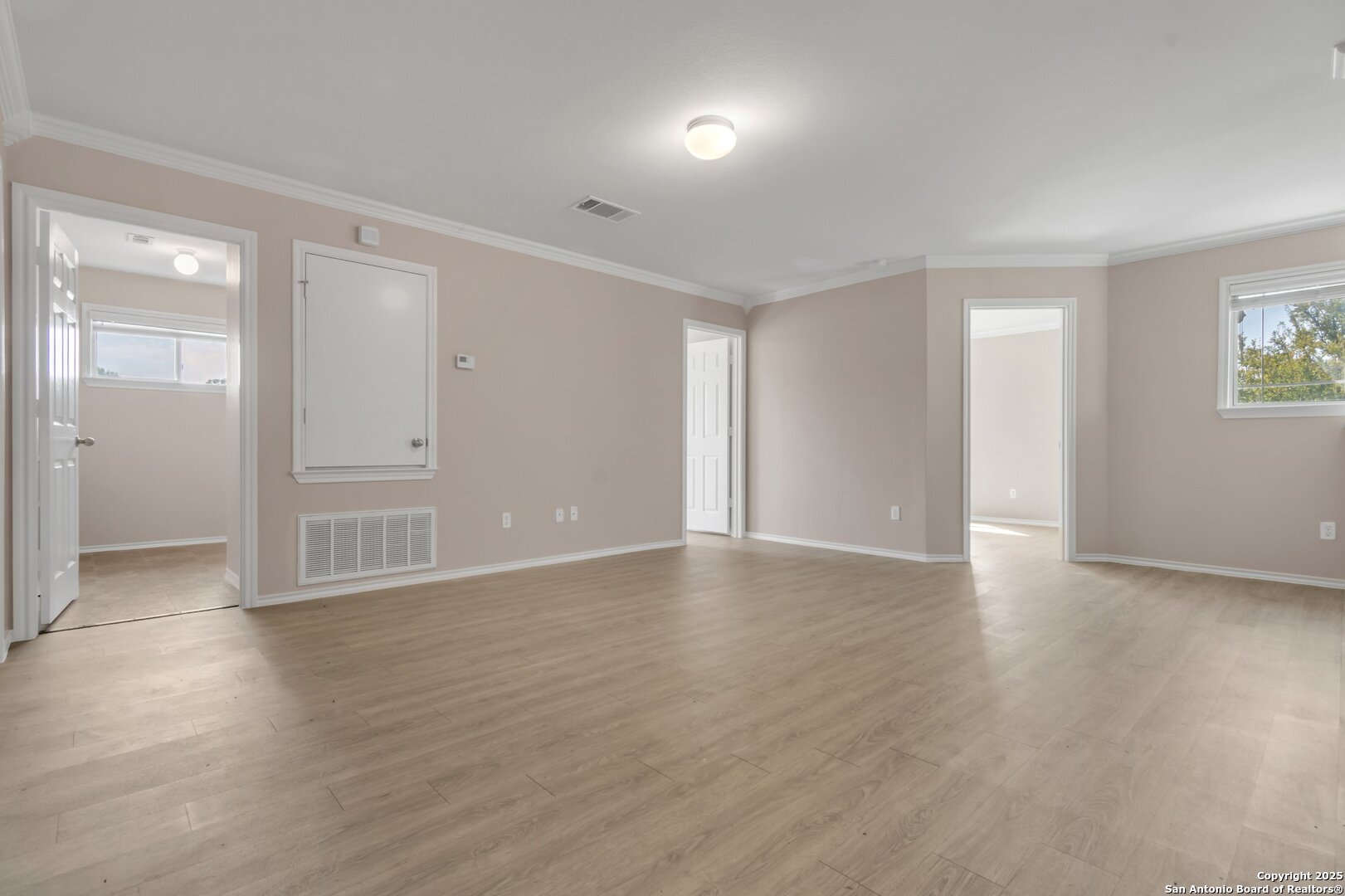 5644 Brougham Way Austin, TX 78754 - Photo 12 of 31 a view of an empty room with wooden floor and a window