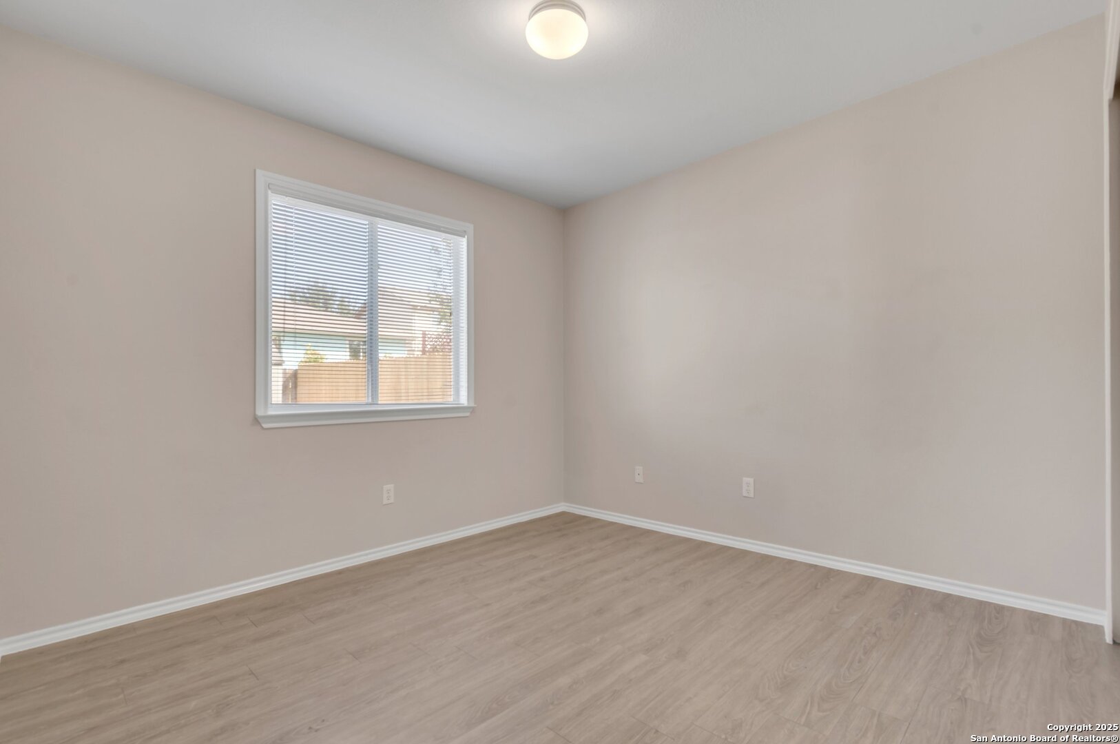 5644 Brougham Way Austin, TX 78754 - Photo 23 of 31 an empty room with wooden floor and windows