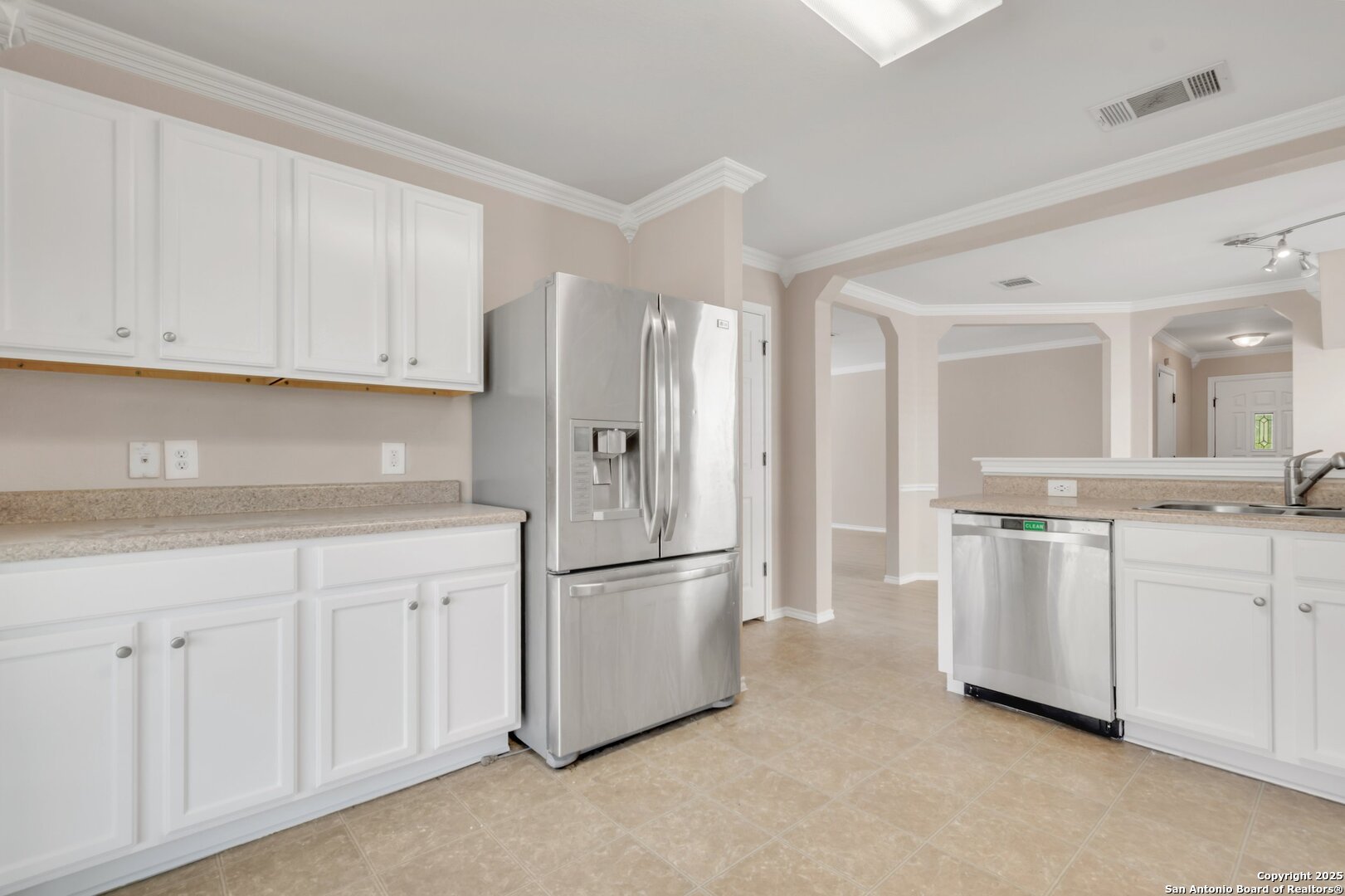 5644 Brougham Way Austin, TX 78754 - Photo 3 of 31 a kitchen with white cabinets and refrigerator