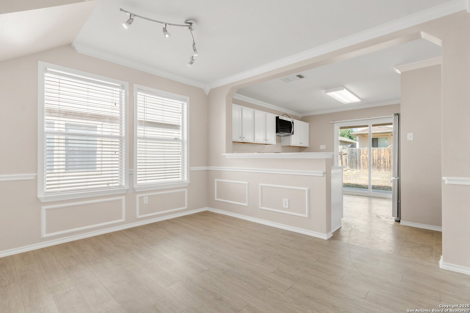 5644 Brougham Way Austin, TX 78754 - Photo 5 of 31 a view of empty room with a fireplace and wooden floor