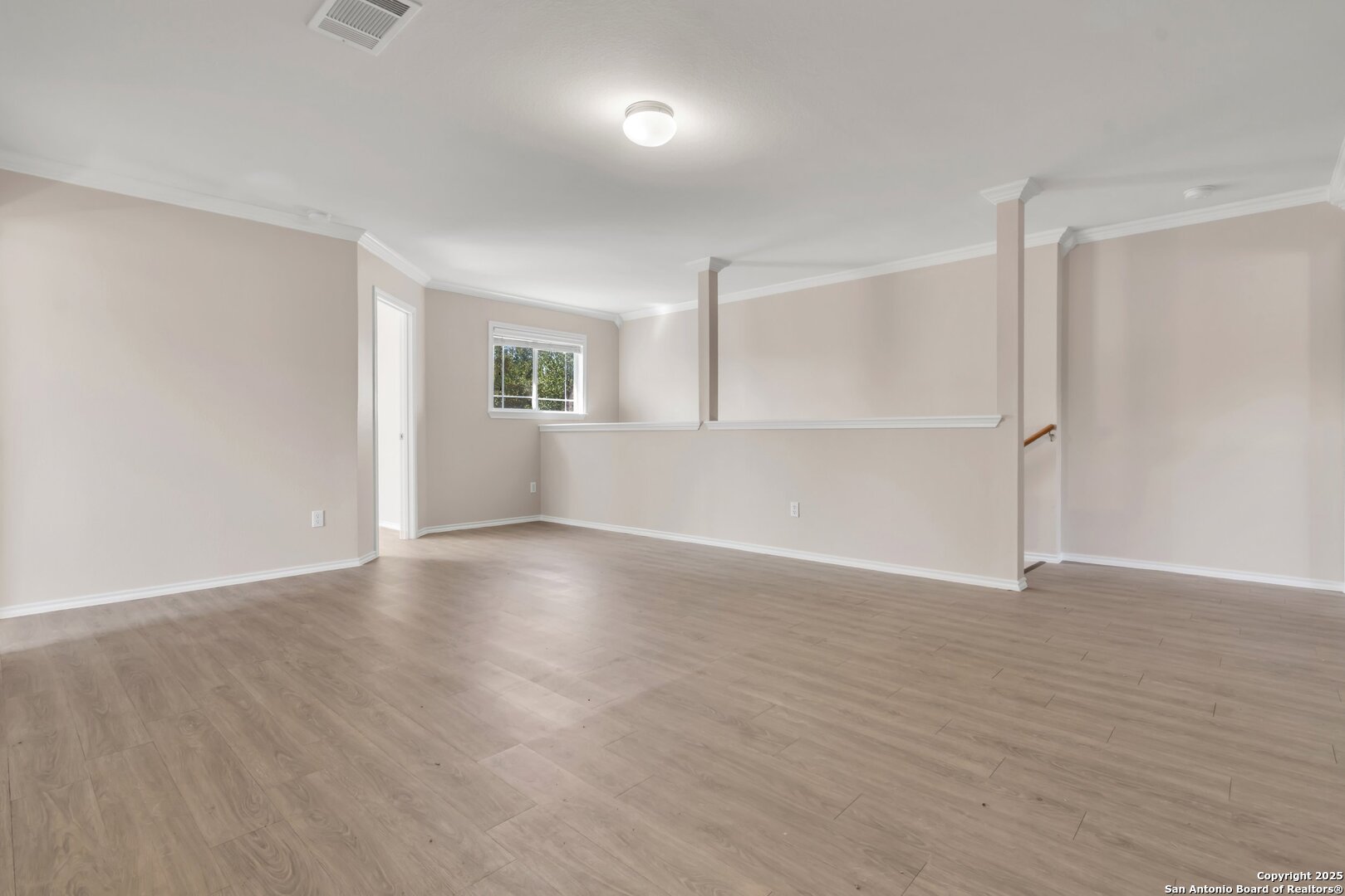5644 Brougham Way Austin, TX 78754 - Photo 10 of 31 a view of an empty room with wooden floor and a window