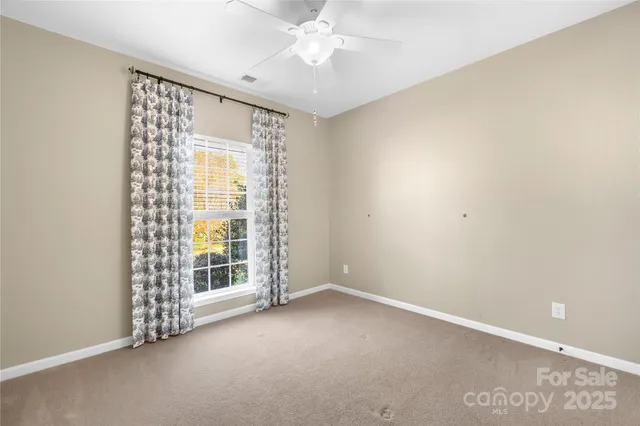 a bedroom with a bed and a table in it