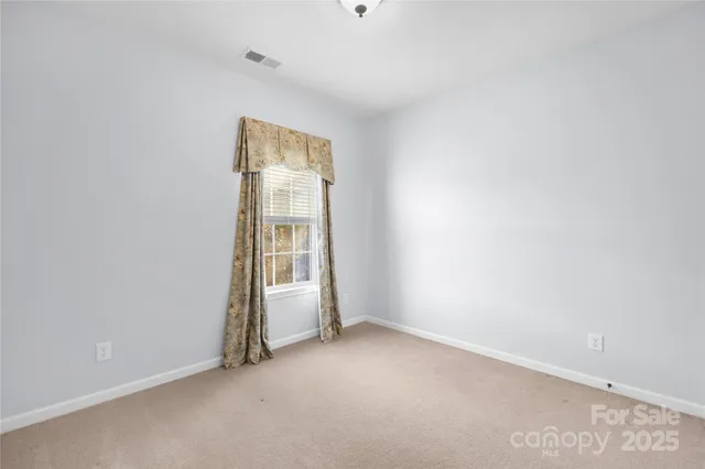 a bedroom with a bed and a desk