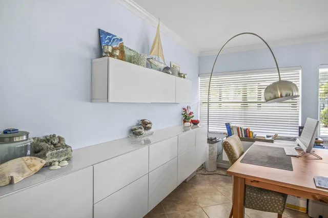a bathroom with a sink and a window