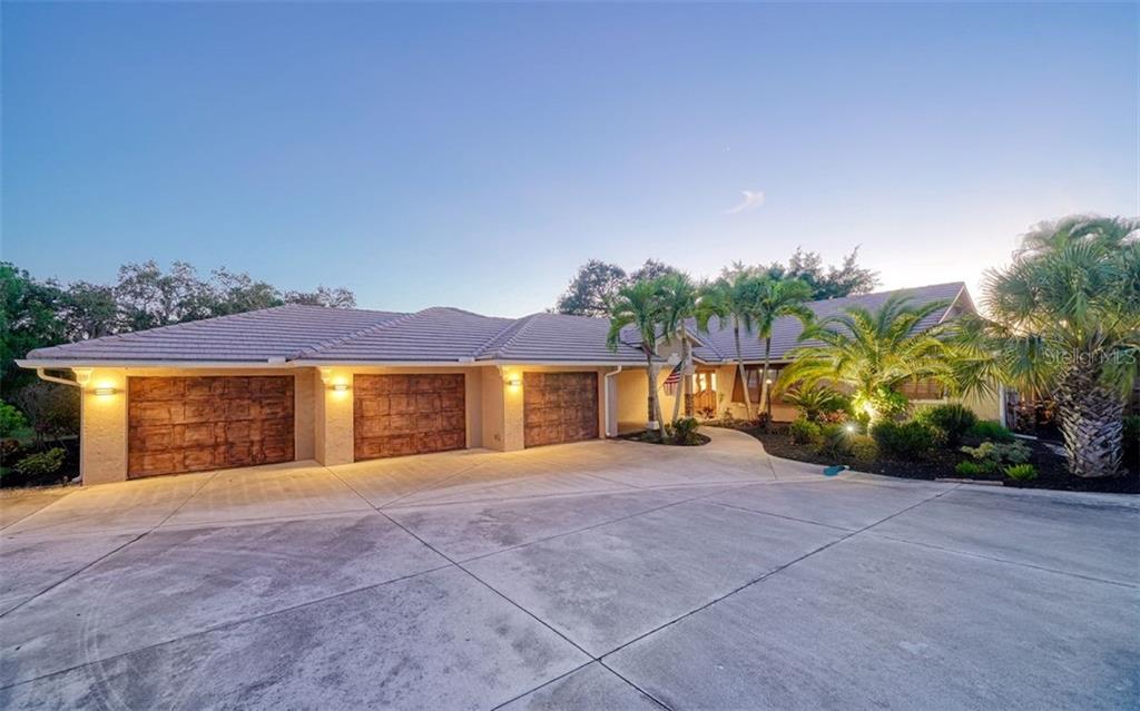 925 Bayshore Road Nokomis, FL 34275 - Photo 1 of 1 Front elevation, 4 car garage/tandem