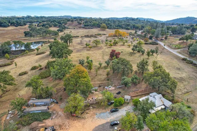 an aerial view of residential house with outdoor space