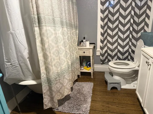 a bedroom with a bed and a cabinets