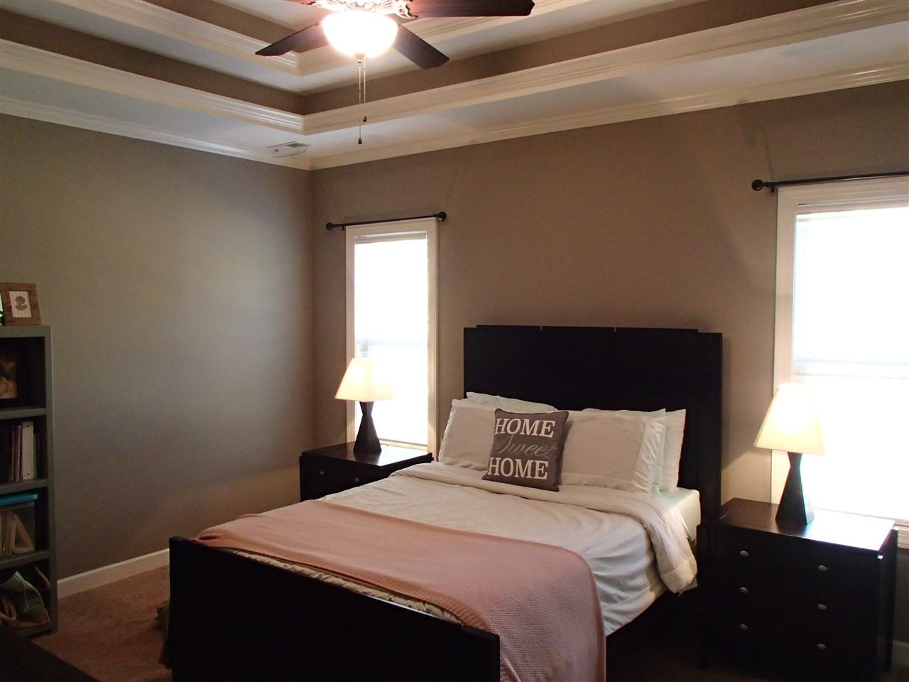 2183 Matthews Road Clayton, NC 27520 - Photo 21 of 25 The large master bedroom has a DOUBLE trey ceiling and a large walk-in-closet with custom built in shelving. Master Bedroom