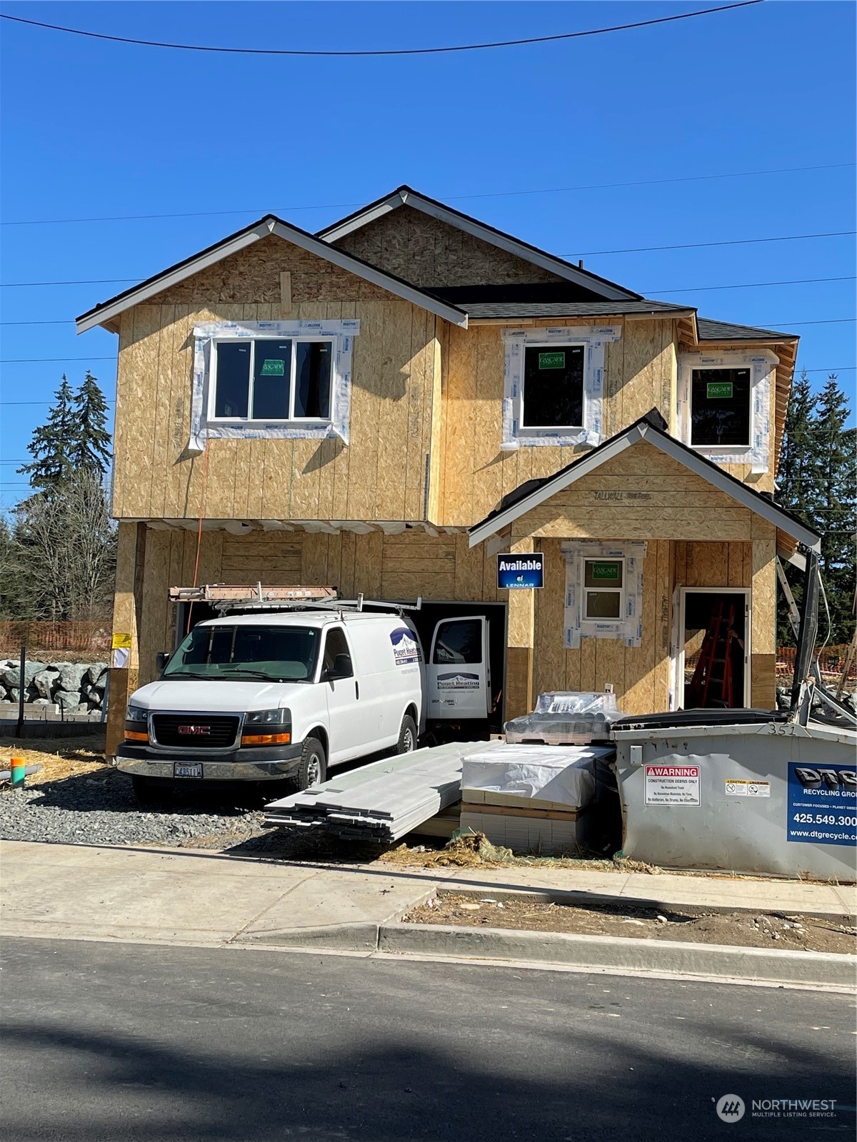 21109 42nd Avenue Southeast, Unit 119 Bothell, WA 98021 - Photo 1 of 19 a front view of a house with a yard