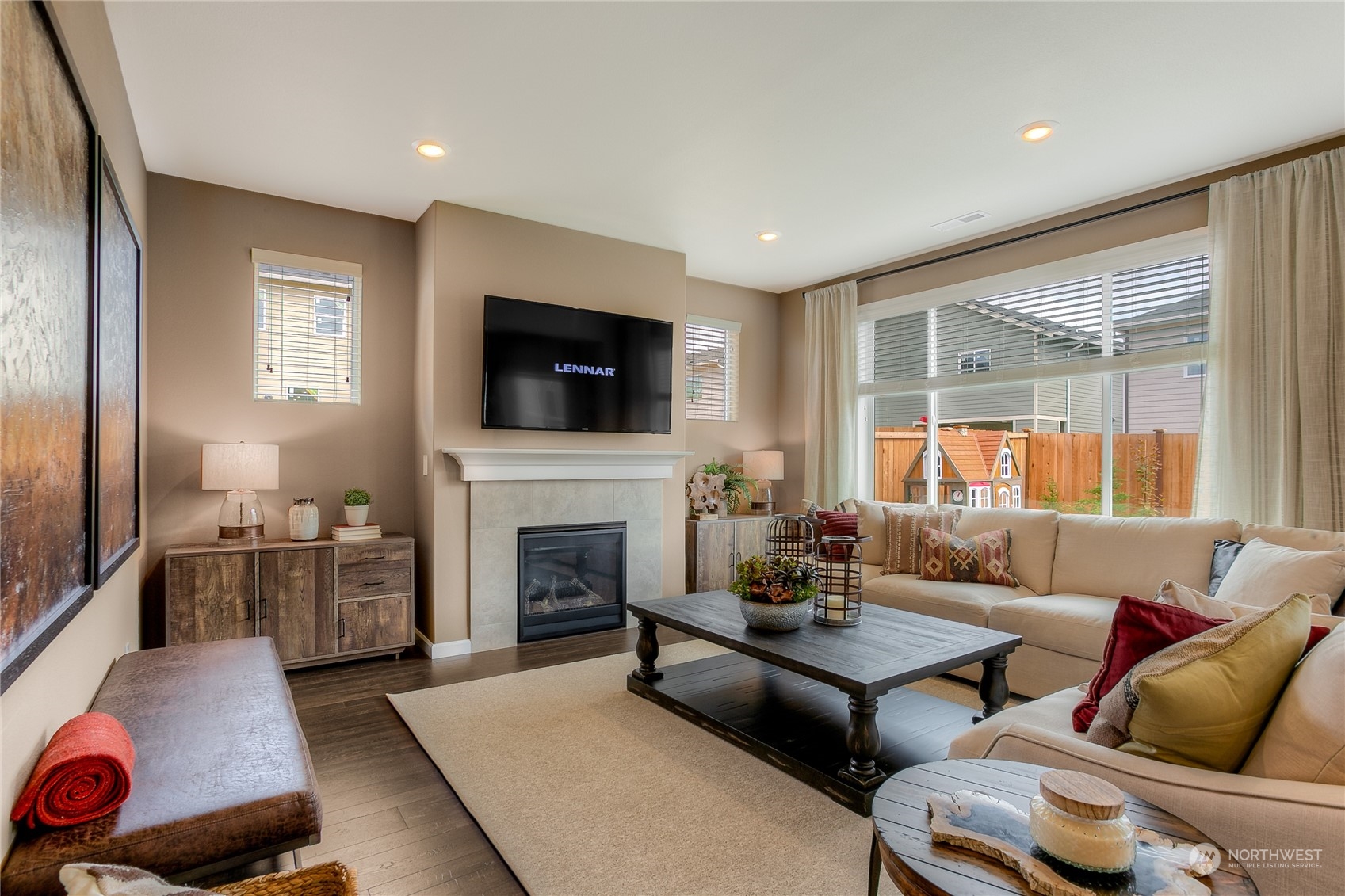21109 42nd Avenue Southeast, Unit 119 Bothell, WA 98021 - Photo 10 of 19 a living room with furniture fireplace and a flat screen tv