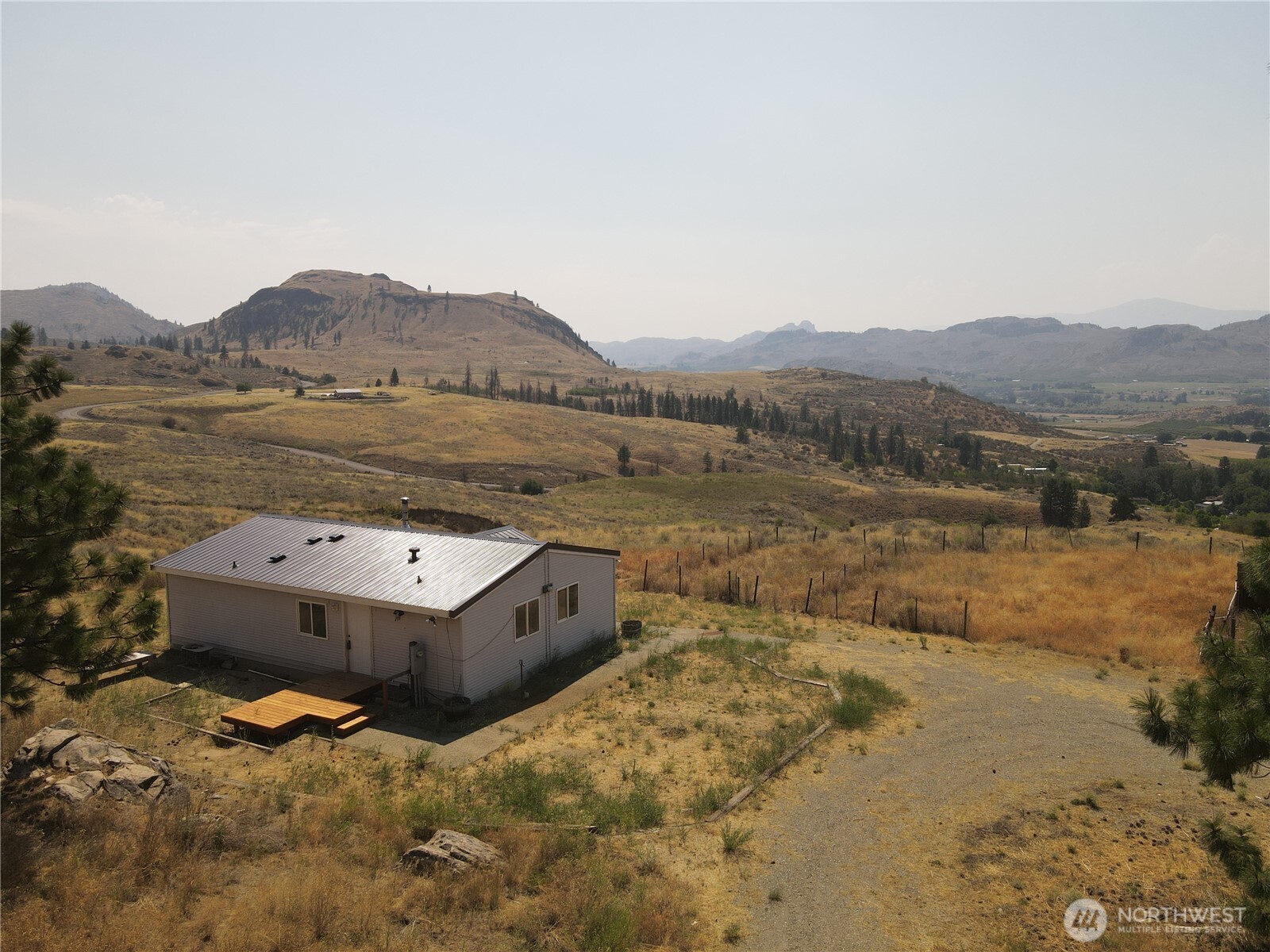 105 Swanson Mill Road Oroville, WA 98844 - Photo 1 of 37 a view of lake with mountain