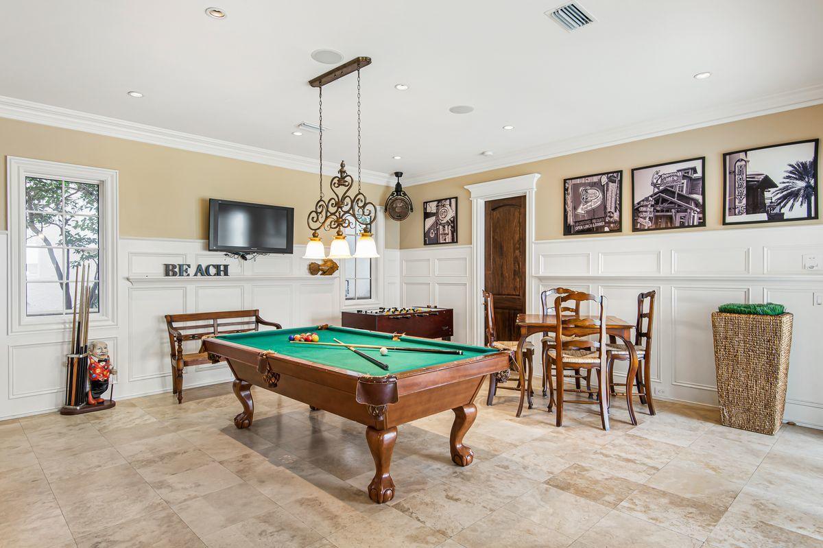 4789 Ocean Boulevard Destin, FL 32541 - Photo 13 of 47 a room with furniture a dining table and a fireplace