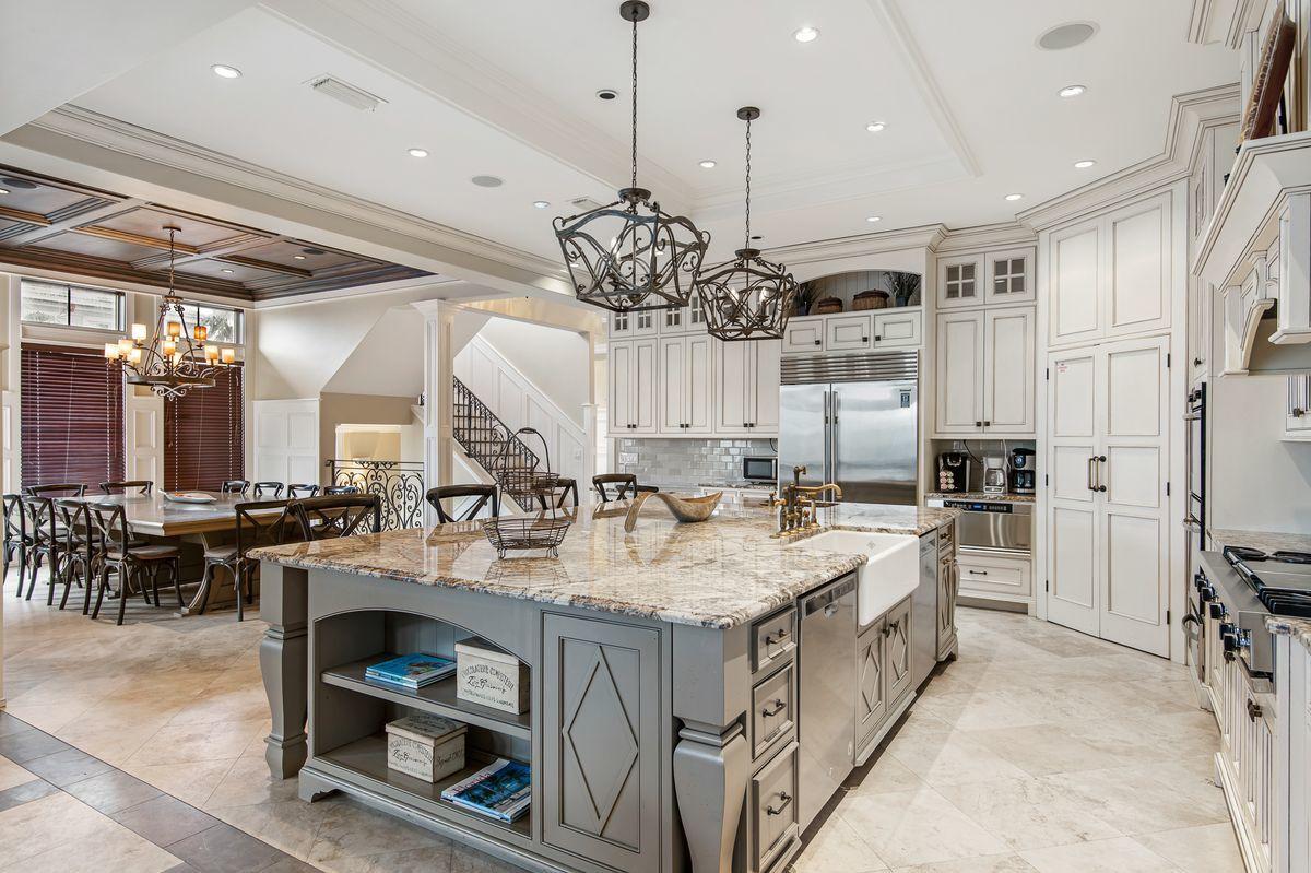 4789 Ocean Boulevard Destin, FL 32541 - Photo 15 of 47 a large kitchen with a table and chairs