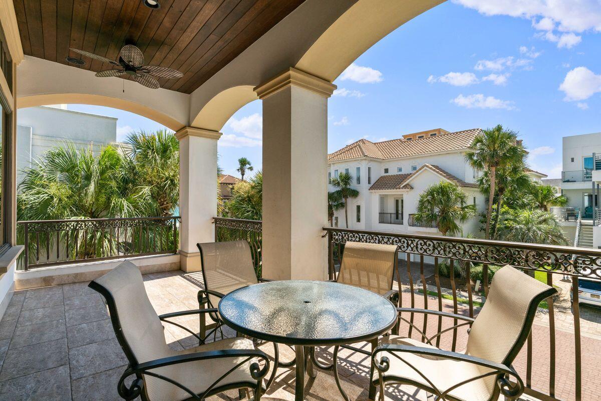 4789 Ocean Boulevard Destin, FL 32541 - Photo 19 of 47 a view of a chairs and table in the balcony