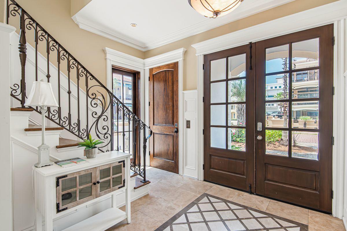 4789 Ocean Boulevard Destin, FL 32541 - Photo 23 of 47 a view of entryway with stairs and wooden floor