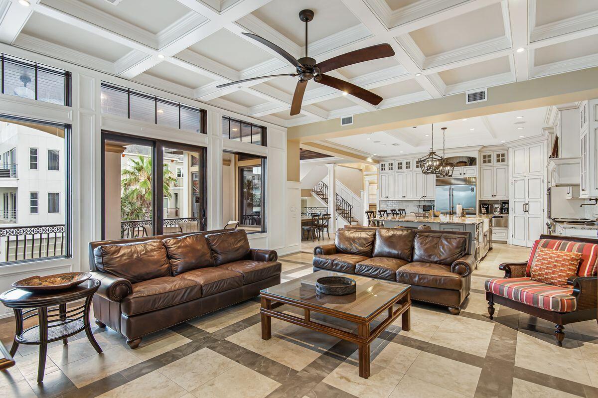 4789 Ocean Boulevard Destin, FL 32541 - Photo 3 of 47 a living room with furniture a ceiling fan and a rug