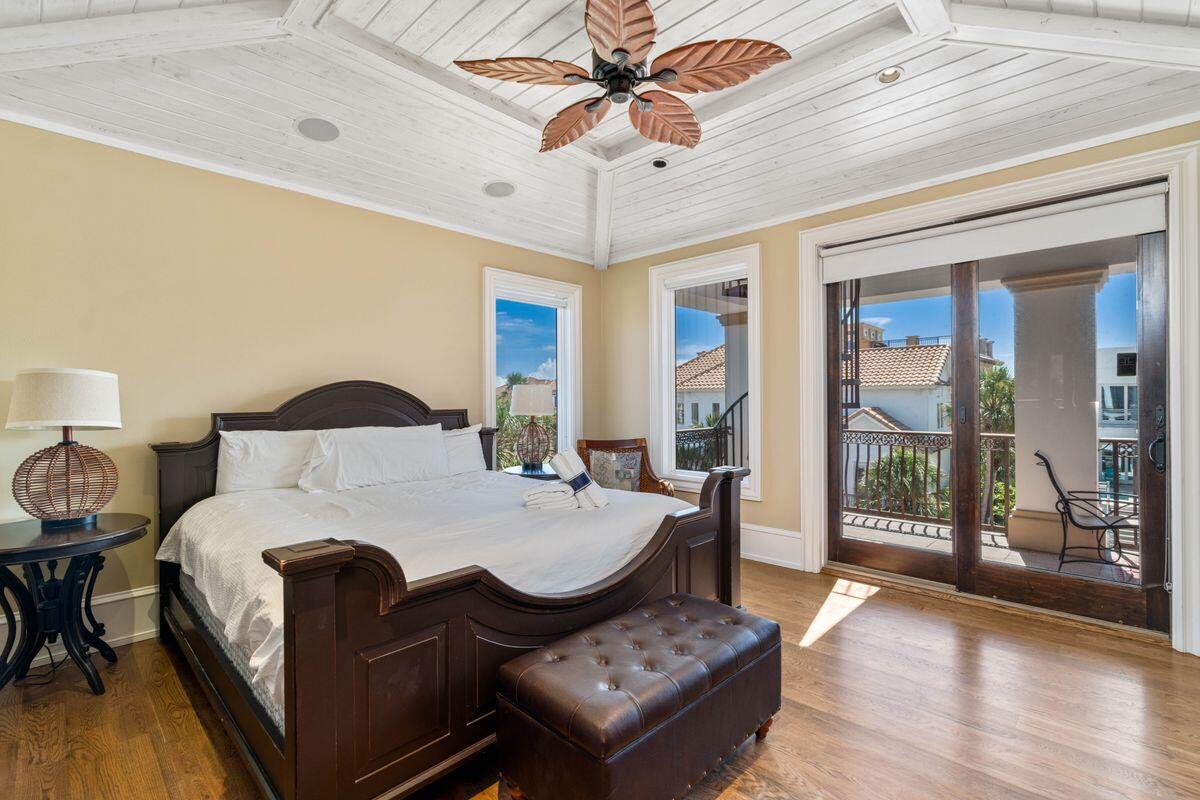 4789 Ocean Boulevard Destin, FL 32541 - Photo 32 of 47 a bed room with a bed and a chandelier