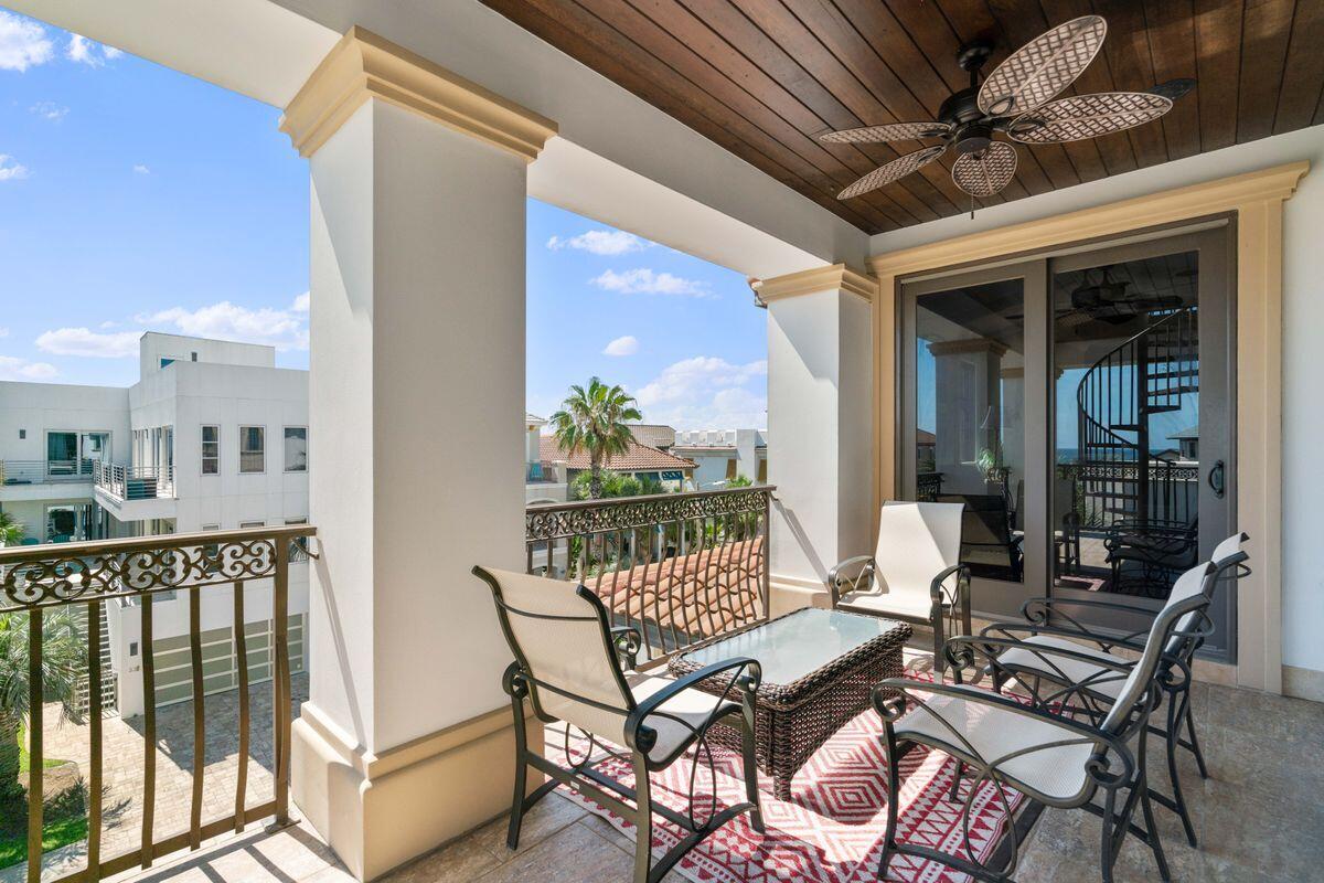 4789 Ocean Boulevard Destin, FL 32541 - Photo 34 of 47 a view of a balcony dining area with furniture