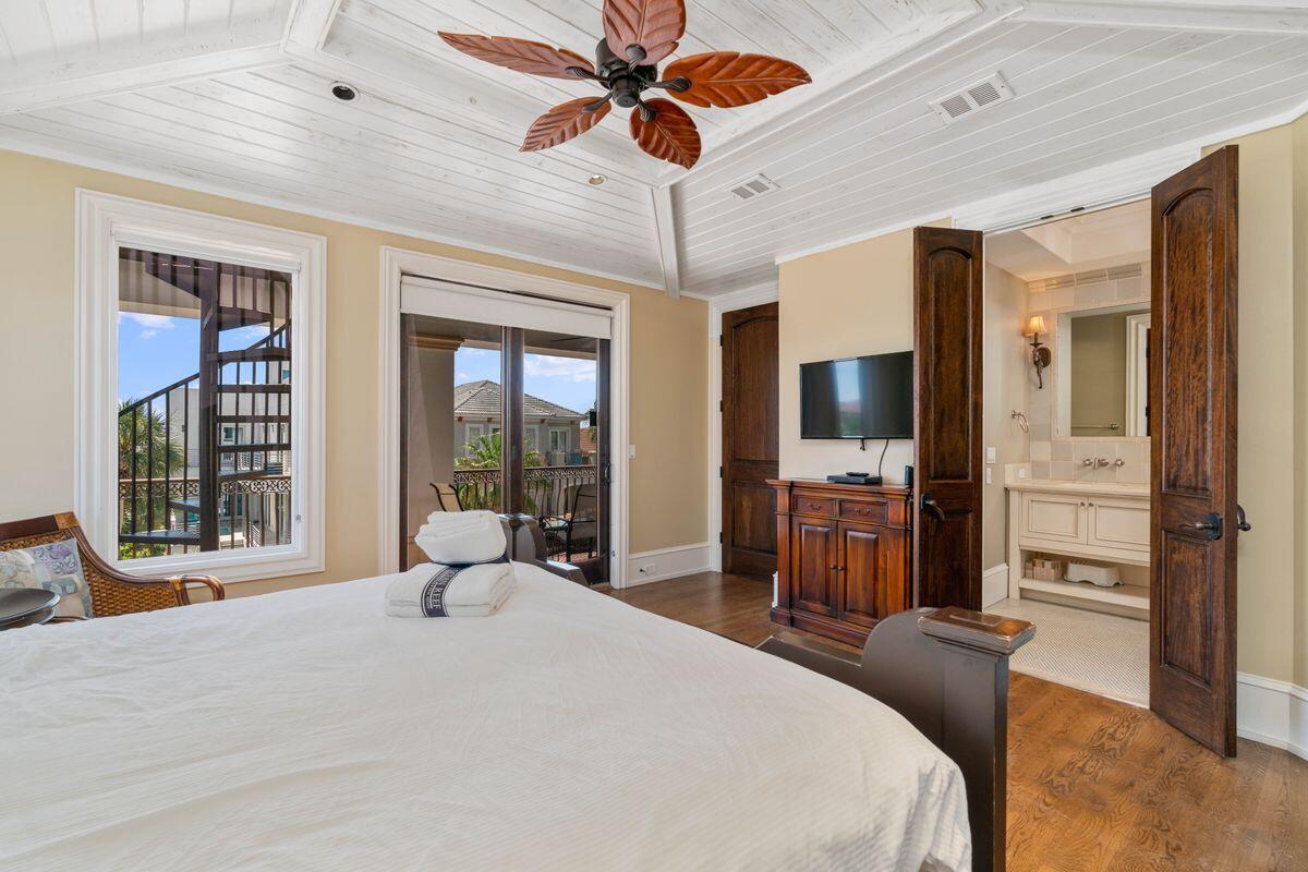 4789 Ocean Boulevard Destin, FL 32541 - Photo 35 of 47 a bedroom with a bed and a large window with the outer view