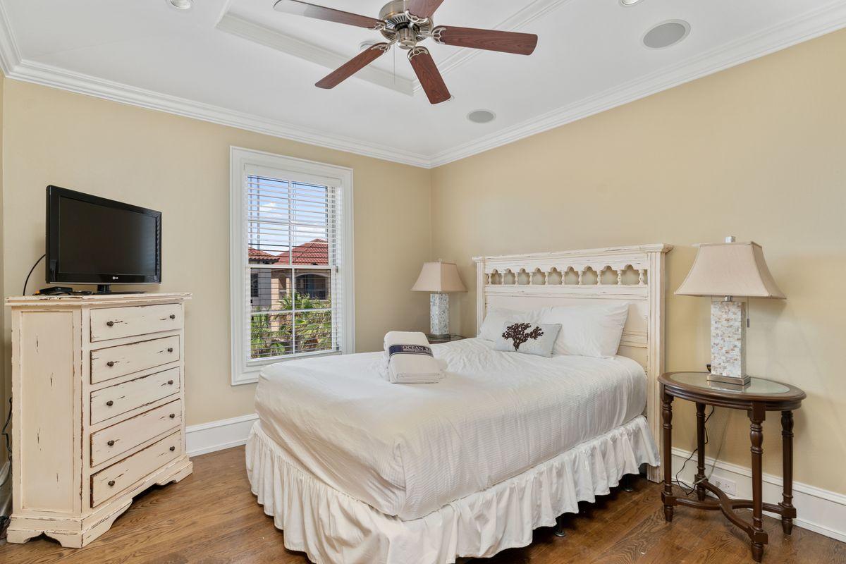 4789 Ocean Boulevard Destin, FL 32541 - Photo 37 of 47 a bedroom with a bed and a flat screen tv