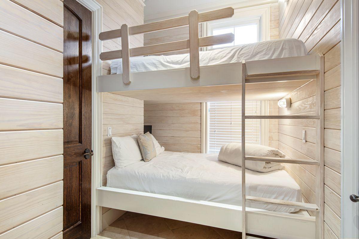 4789 Ocean Boulevard Destin, FL 32541 - Photo 40 of 47 a bedroom with a large window and a glass door