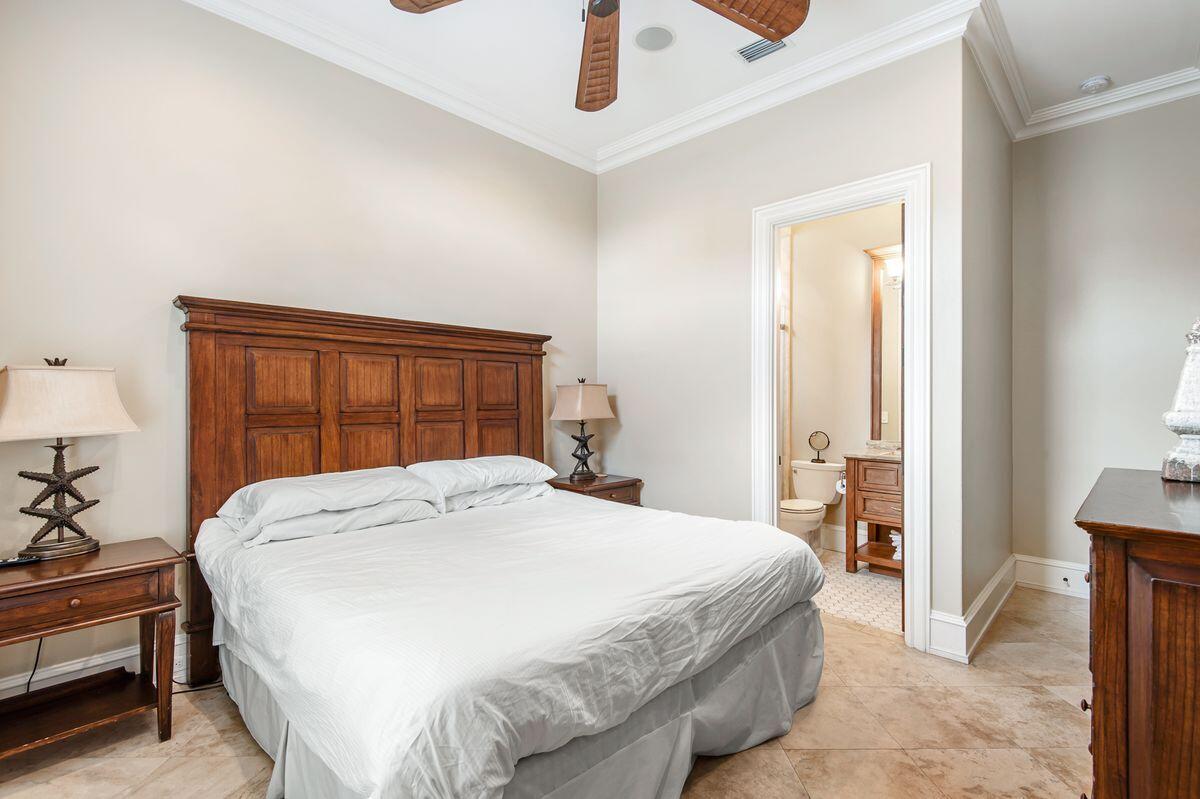 4789 Ocean Boulevard Destin, FL 32541 - Photo 42 of 47 a bedroom with a bed and a large window