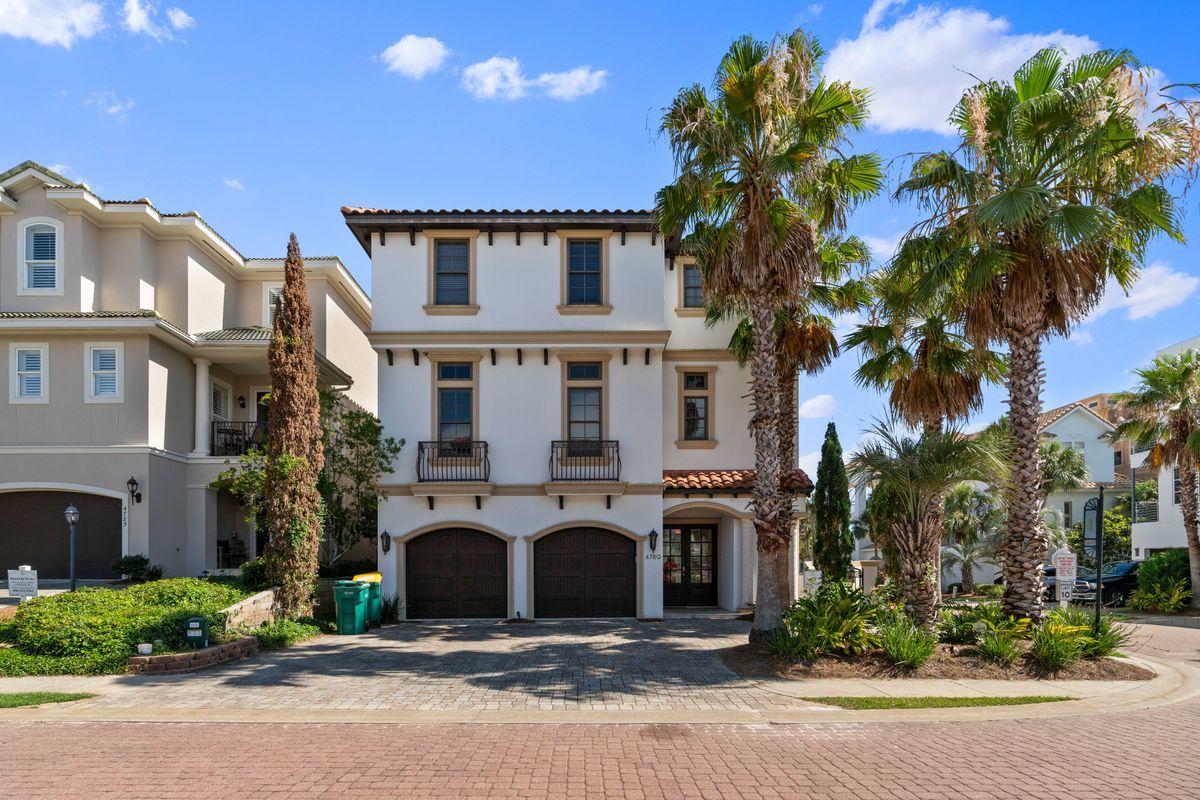 4789 Ocean Boulevard Destin, FL 32541 - Photo 45 of 47 a front view of a building with garden