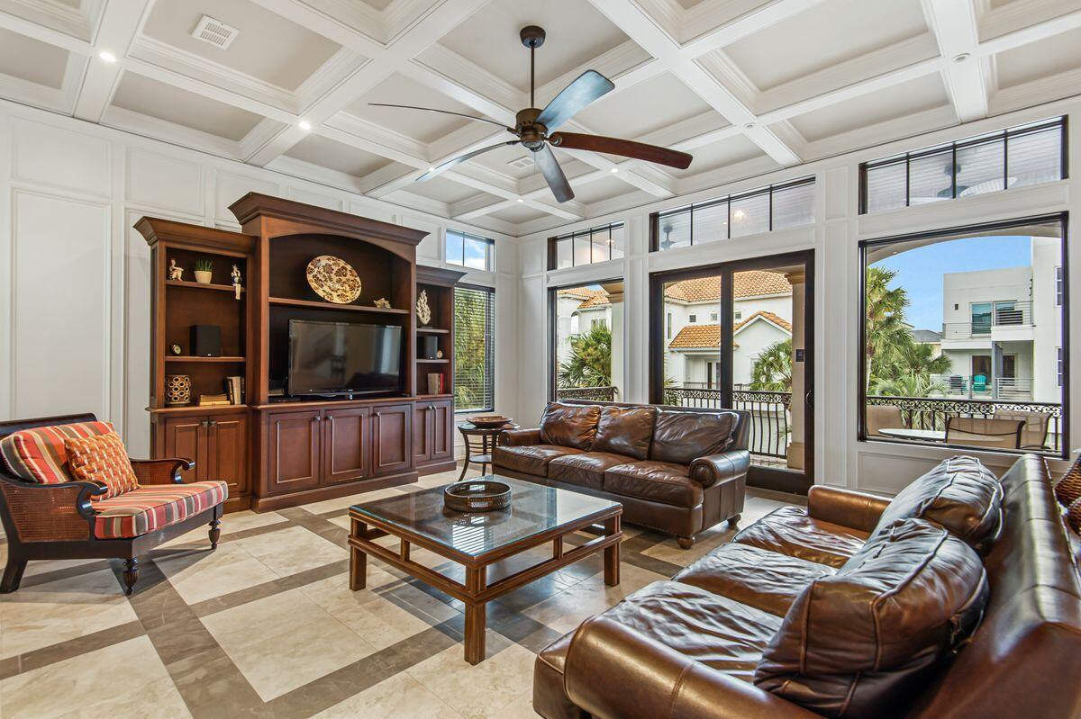 4789 Ocean Boulevard Destin, FL 32541 - Photo 6 of 47 a living room with furniture a flat screen tv and a large window
