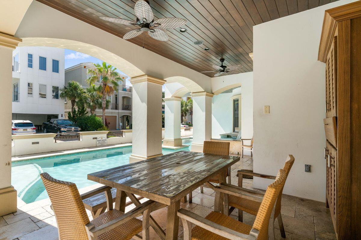 4789 Ocean Boulevard Destin, FL 32541 - Photo 9 of 47 a view of a dining room with furniture