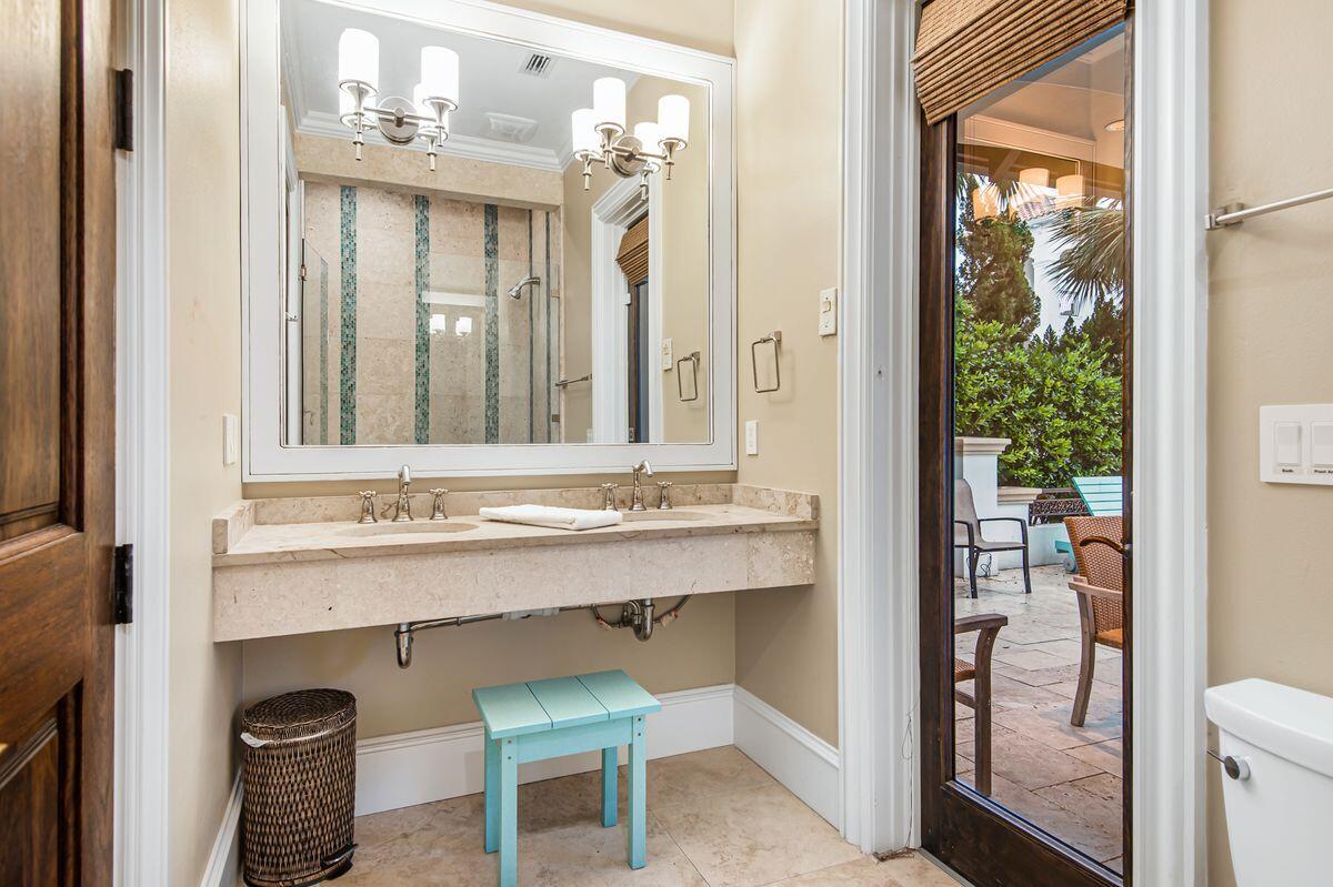 4789 Ocean Boulevard Destin, FL 32541 - Photo 10 of 47 a bathroom with a sink and a mirror